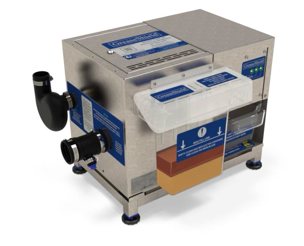 Greaseshield GS1000AST grease recovery unit, side view showing twin inlet pipe connections and clear grease tray